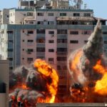 Israel launches dozens of Gaza strikes as fighting enters second week