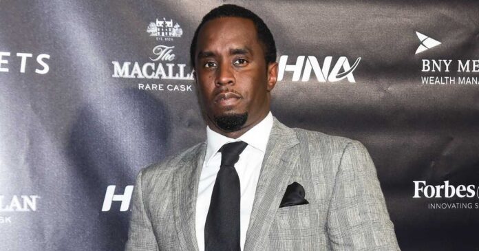 Picture of Sean 'Diddy' Combs wearing a grey suit at an event